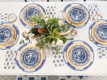 tablescape with chinoiserie and gold plates