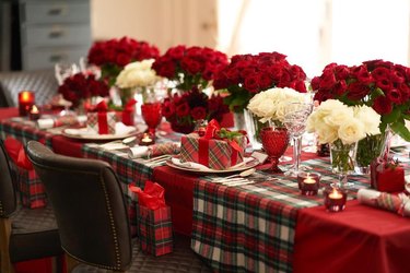 tablescape with plaid runner and red and white roses