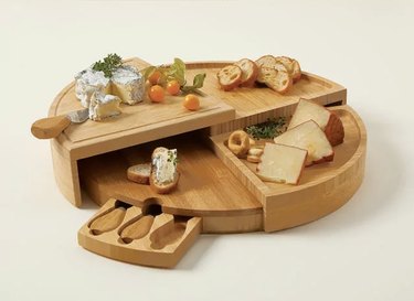 Uncommon Goods Compact Swivel Cheese Board with Knives, starting at $47