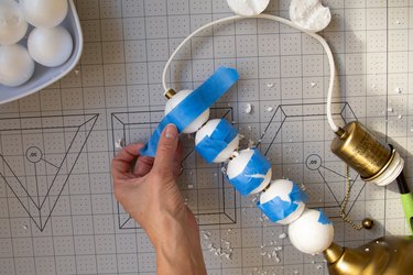 Adding painter's tape to lamp DIY