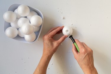 Cutting styrofoam balls for lamp DIY