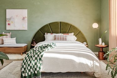 hunker house bedroom with green headboard from article
