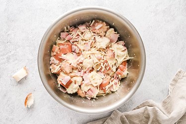 Bread, cheese, and ham in a large bowl
