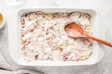 Wooden spoon on top of casserole