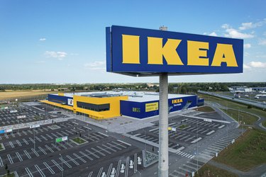 An IKEA store exterior with large sign in the sky.