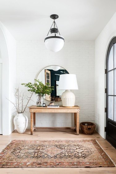 vintage inspired entryway with console table and lamp