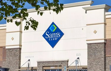 Sam's Club storefront with logo in front of a blue sky.