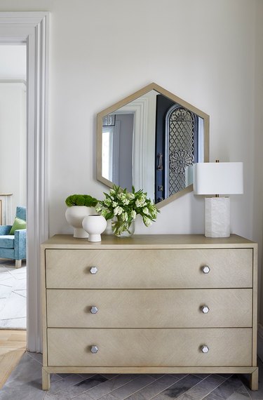 dresser and mirror in traditional entryway