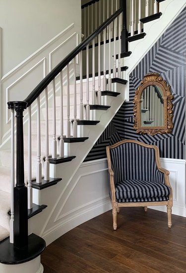 striped wall with striped chair in entryway
