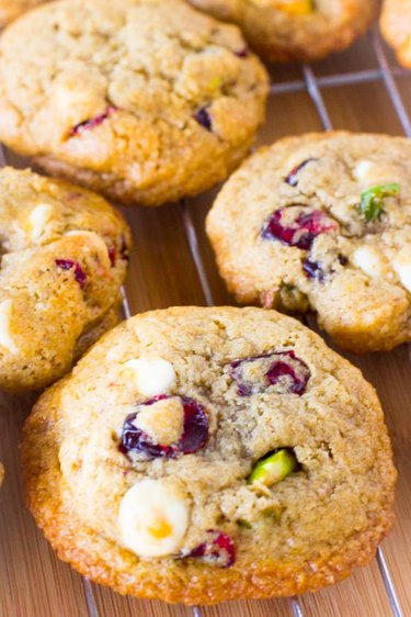 White chocolate cranberry pistachio cookies on a cooling tray