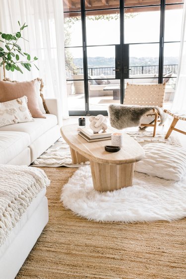 Scandinavian white living room with faux furs