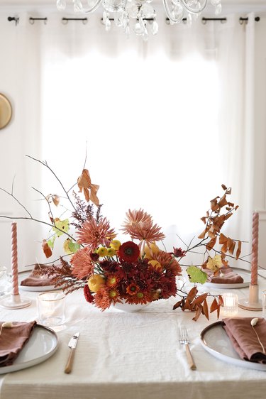 DIY lemon and foraged floral centerpiece on Thanksgiving holiday table