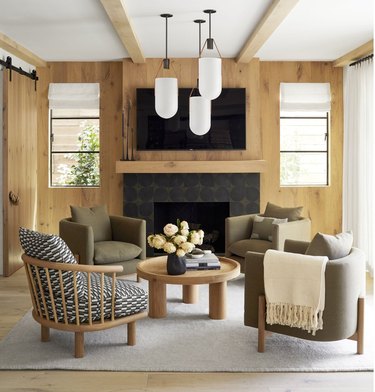 Cabin inspired living room with 3 pendant lights