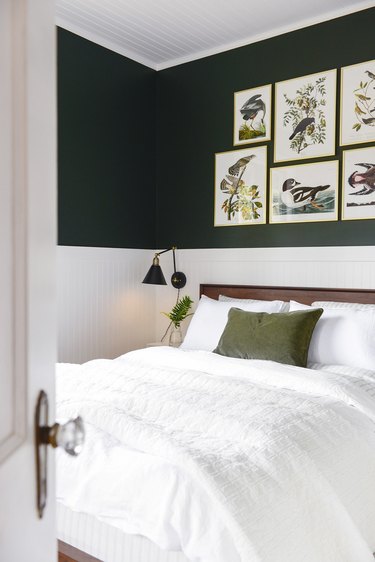 green and white vintage bedroom with gallery wall