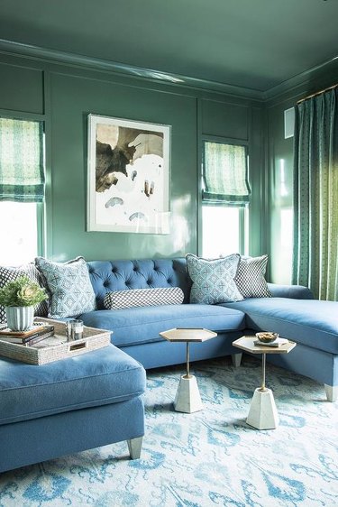 green living room with walls and ceiling painted sage green
