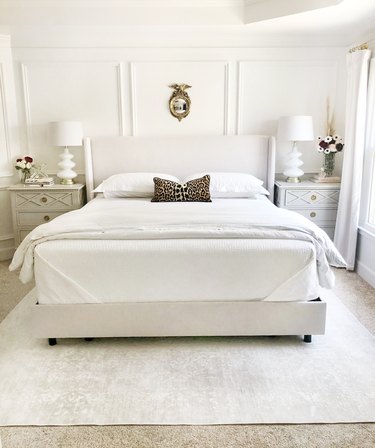 White bed with folded corners
