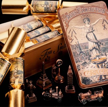 A gold Tom Smith commemorative tin of Christmas crackers to mark the Paris Exhibition of 1900.