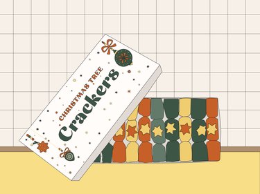 An illustration of a box of "Christmas Tree Crackers" featuring crackers in green, yellow, and orange.