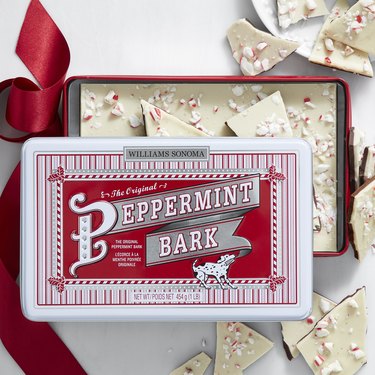 A red and white tin of peppermint bark from Williams Sonoma.