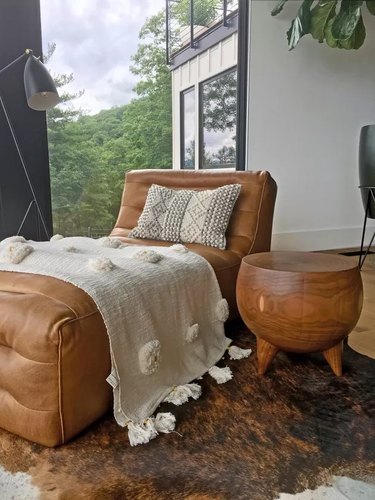 Leather chaise lounge covered in a blanket