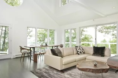 Airy living room with large area rug and wooden coffee table