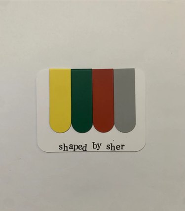 Shaped by Sher magnetic bookmarks in four colors Lemon Yellow, La Salle Green, Fire Engine Red, Philippine Silver)