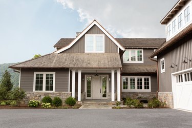 Modern farmhouse with taupe exterior paint