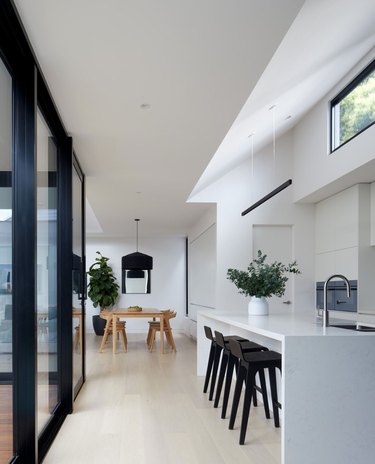 kitchen with white counters and black accents