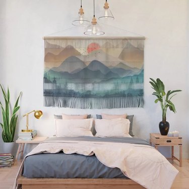 mountain wall hanging in bedroom