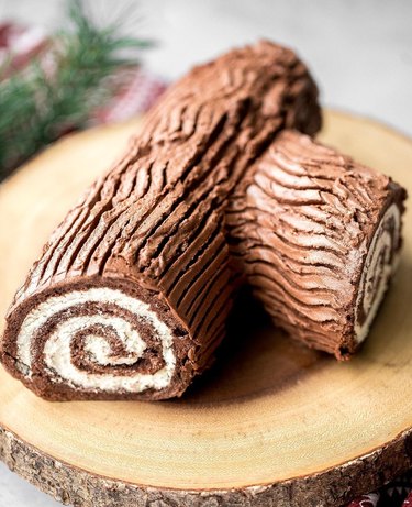A holiday yule log cake on a log