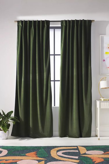 Dark green velvet curtains.