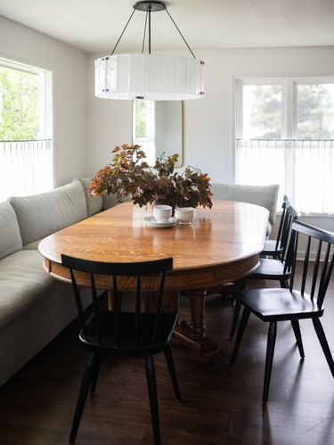 dining room with banquette and black chairs