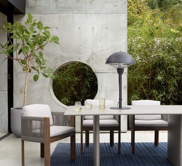 Outdoor table and chairs with table heater.