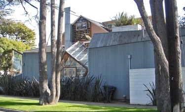 The front yard view of a house with a unique facade