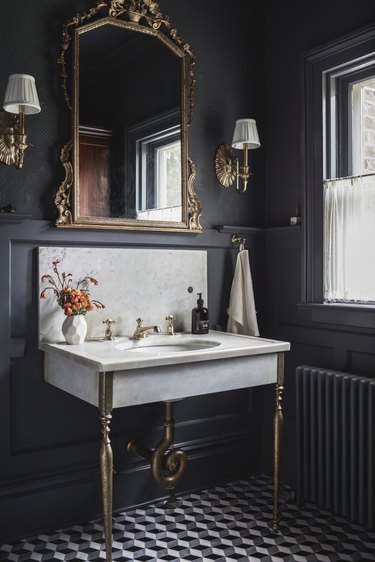 black bathroom with traditional Victorian accents