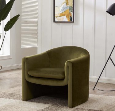 Dark green velvet accent chair.