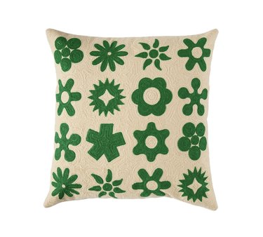 green and tan patterned pillow