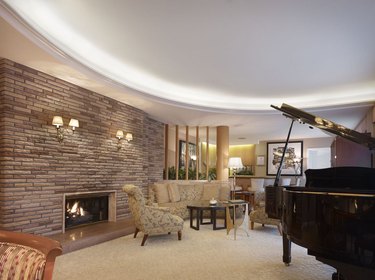 interior with brick wall, seating, and piano