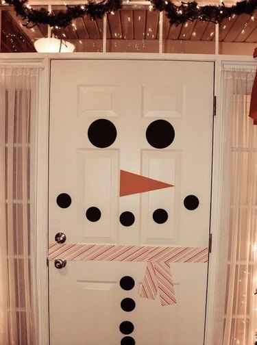 Snowman decor on front door.