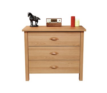 wooden dresser with knick-knacks on top