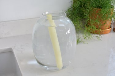 candle submerged in warm water