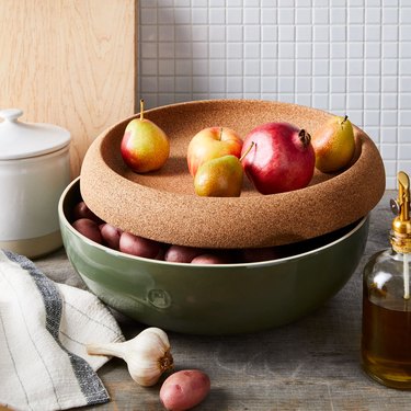 Ceramic storage bowl with fruit