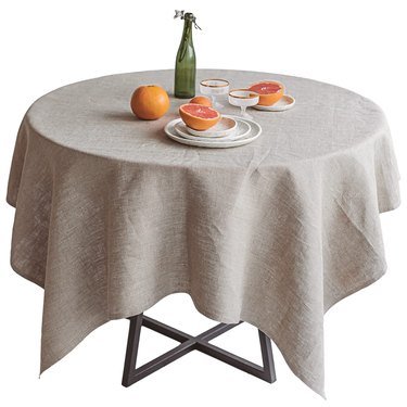 round table with flax linen tablecloth