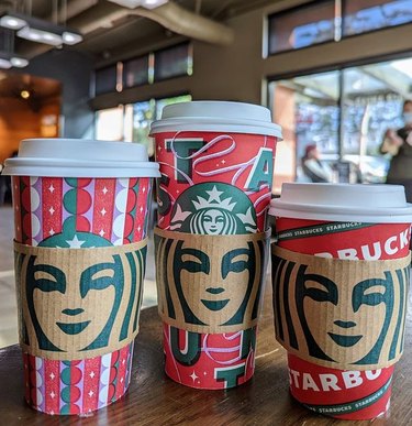 Three Starbucks holiday drinks on a table