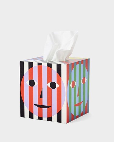 tissue box with stripes and faces