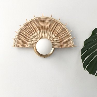 rattan sconce with globe