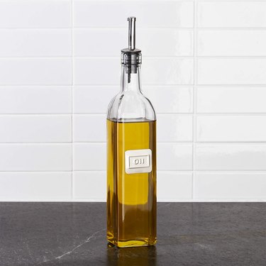 clear bottle of olive oil