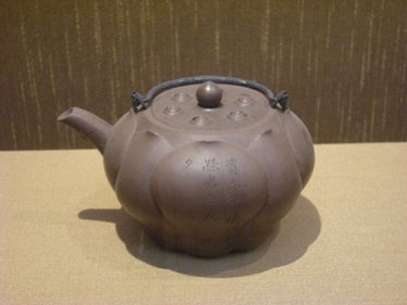 A zisha lotus-shaped teapot with silver handle made by Chen Mingyuan in the Suzhou museum