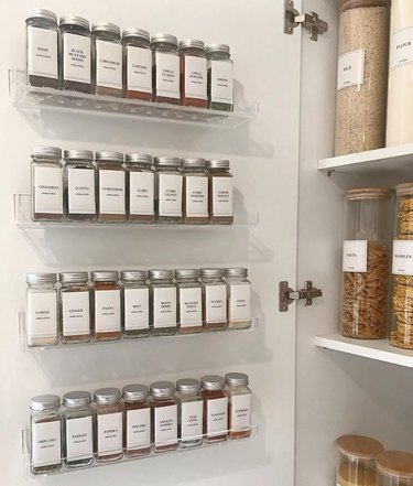 Matching spices hung on cabinet door.