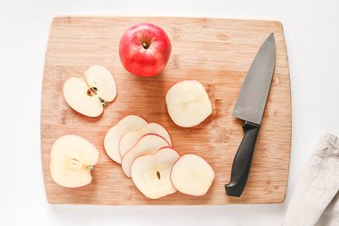Apple slices on a cutting board